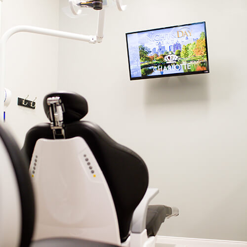 Office dental chair facing a TV monitor