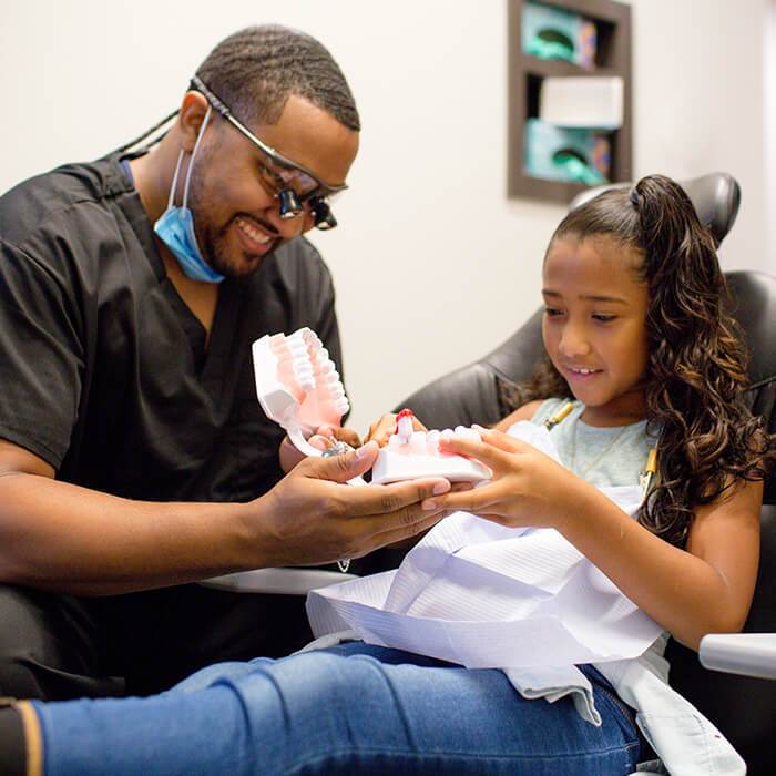 One of our North Carolina dentists working with a young patient at Day & Night Dental.