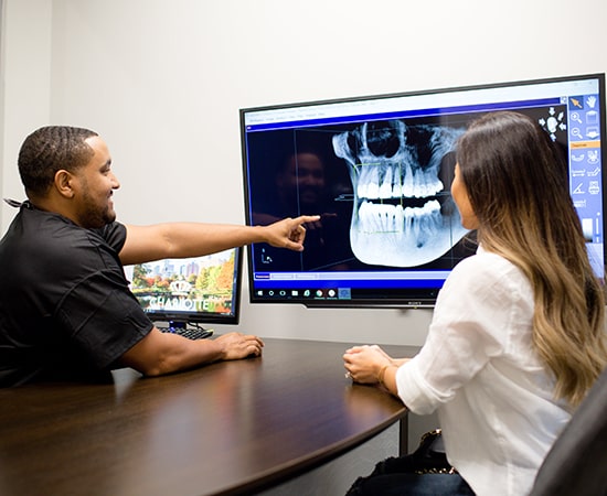 North Carolina dentist going over treatment options with a patient