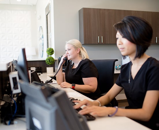 Night and Day Dental front desk answering the phone for dental emergency services
