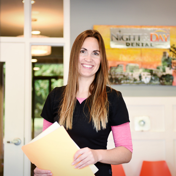 Dental team member smiles